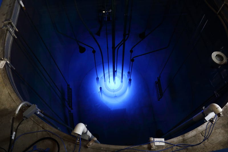 The core of a research reactor emitting a glow due to radiation.