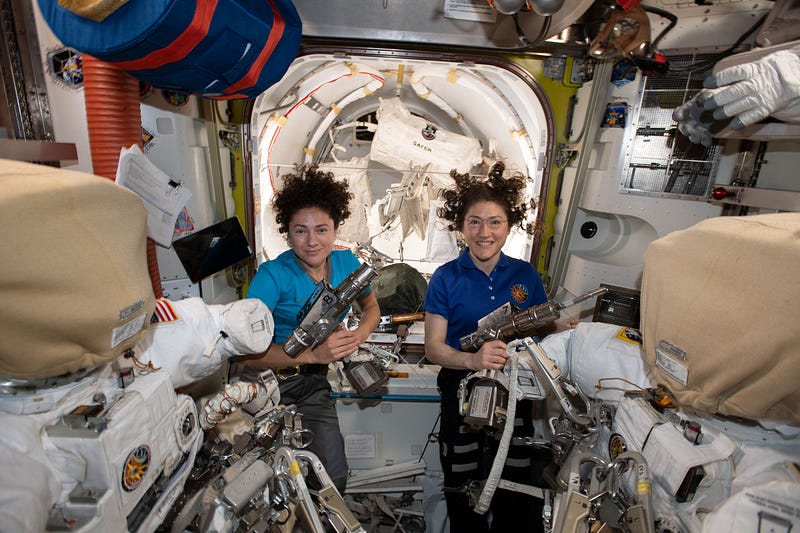 Women astronauts during a spacewalk